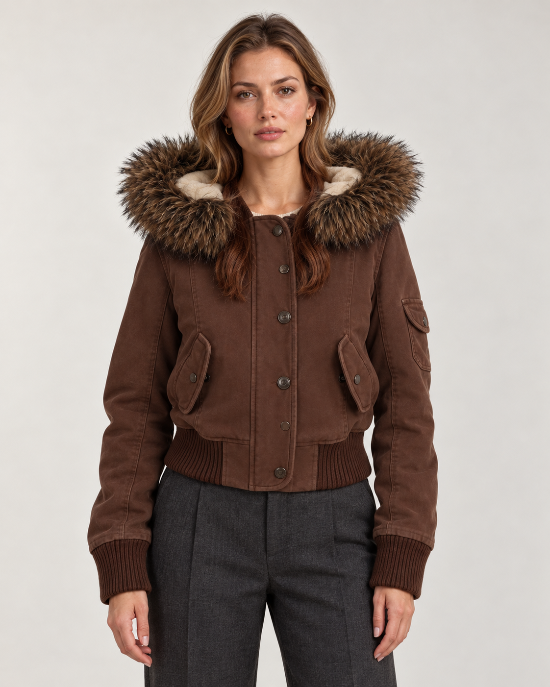 Women's brown bomber jacket, front view on model