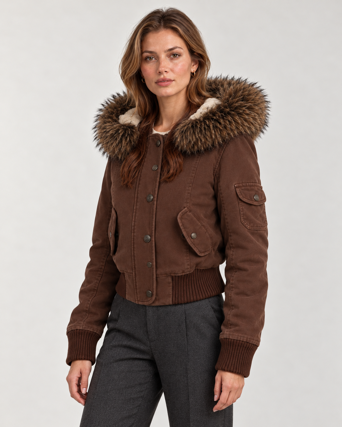 Women's brown bomber jacket, three-quarter view on model