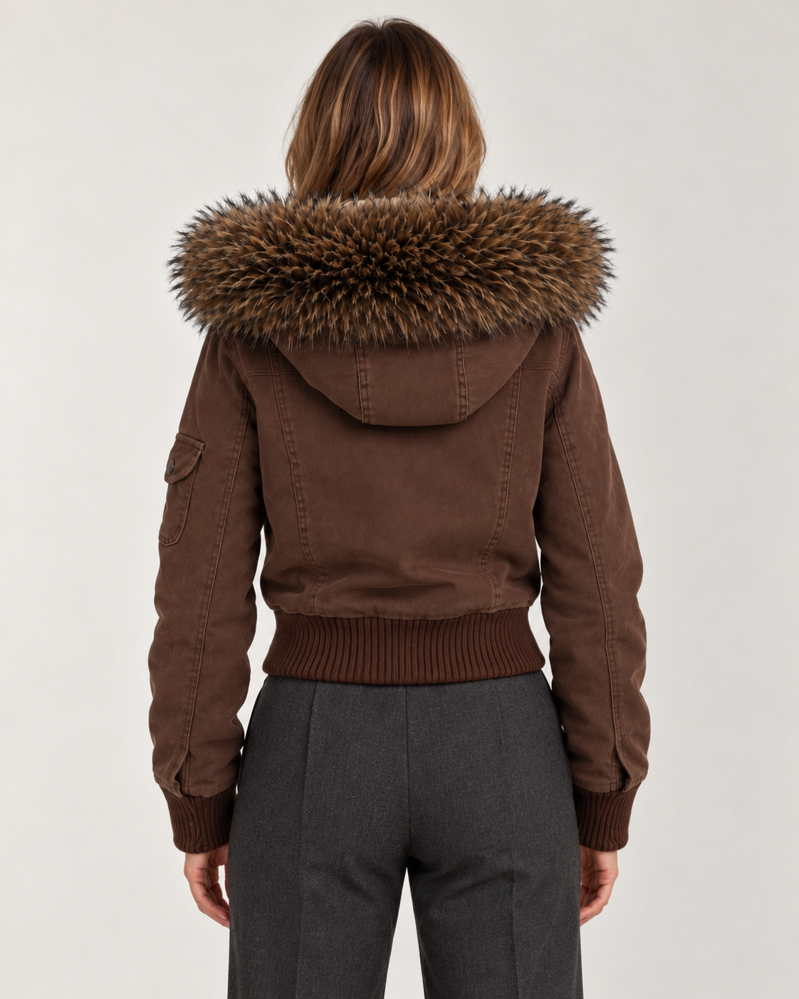 Women's brown bomber jacket, back view on model