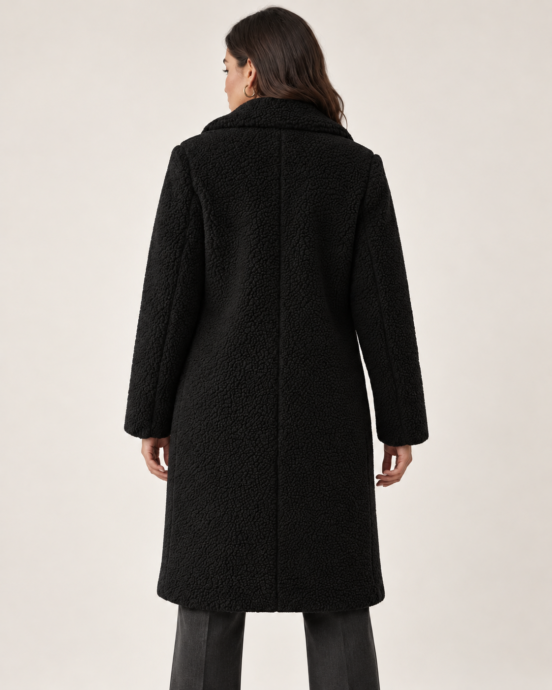 Women's black long textured jacket, back view