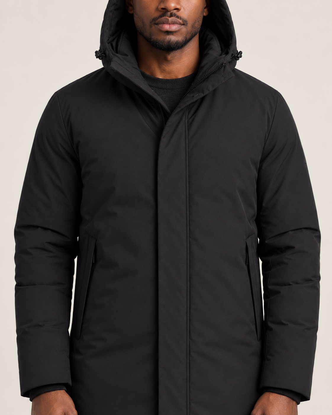 Men's hooded puffer jacket in black, detail view