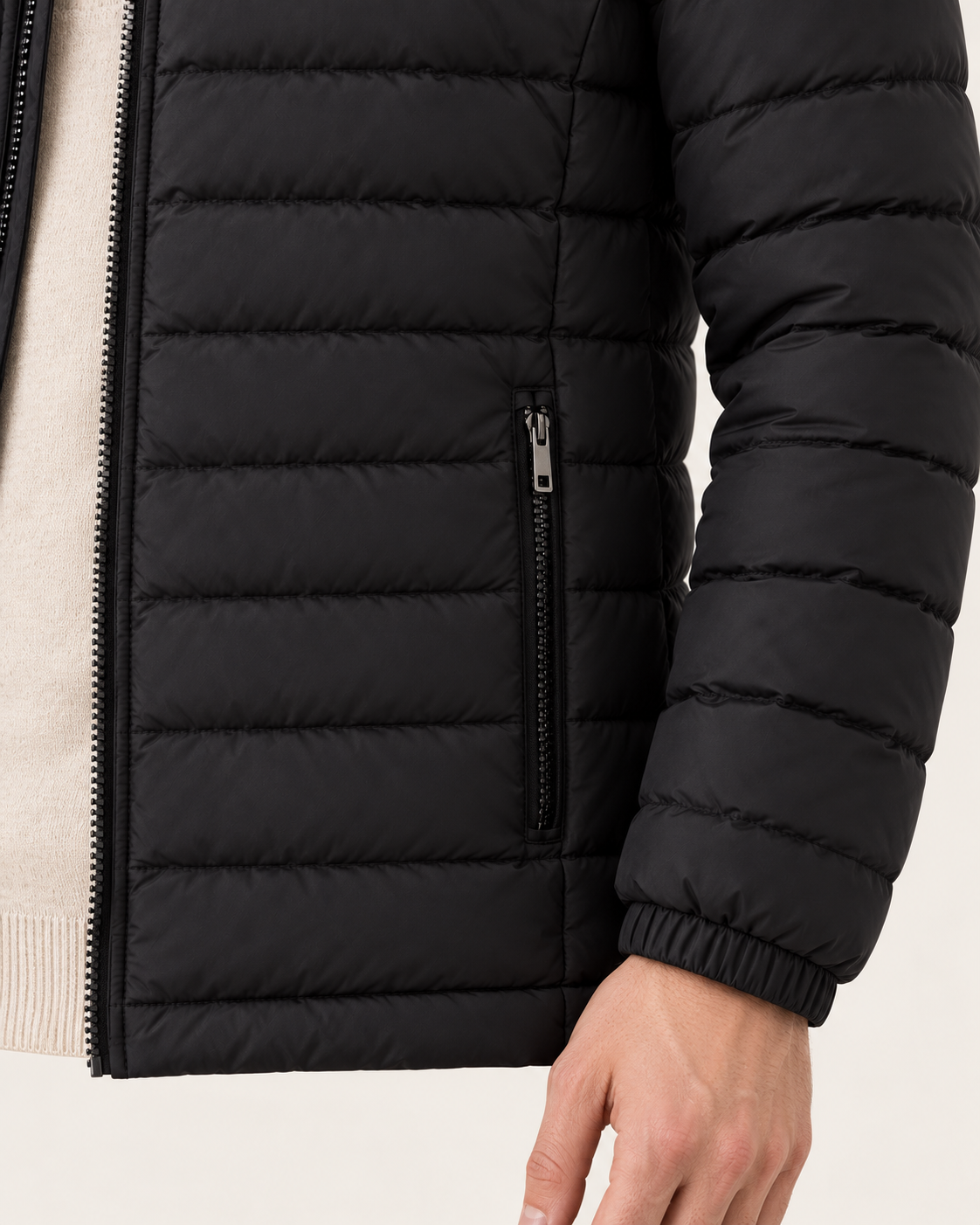 Men's lightweight puffer jacket in black, pocket detail