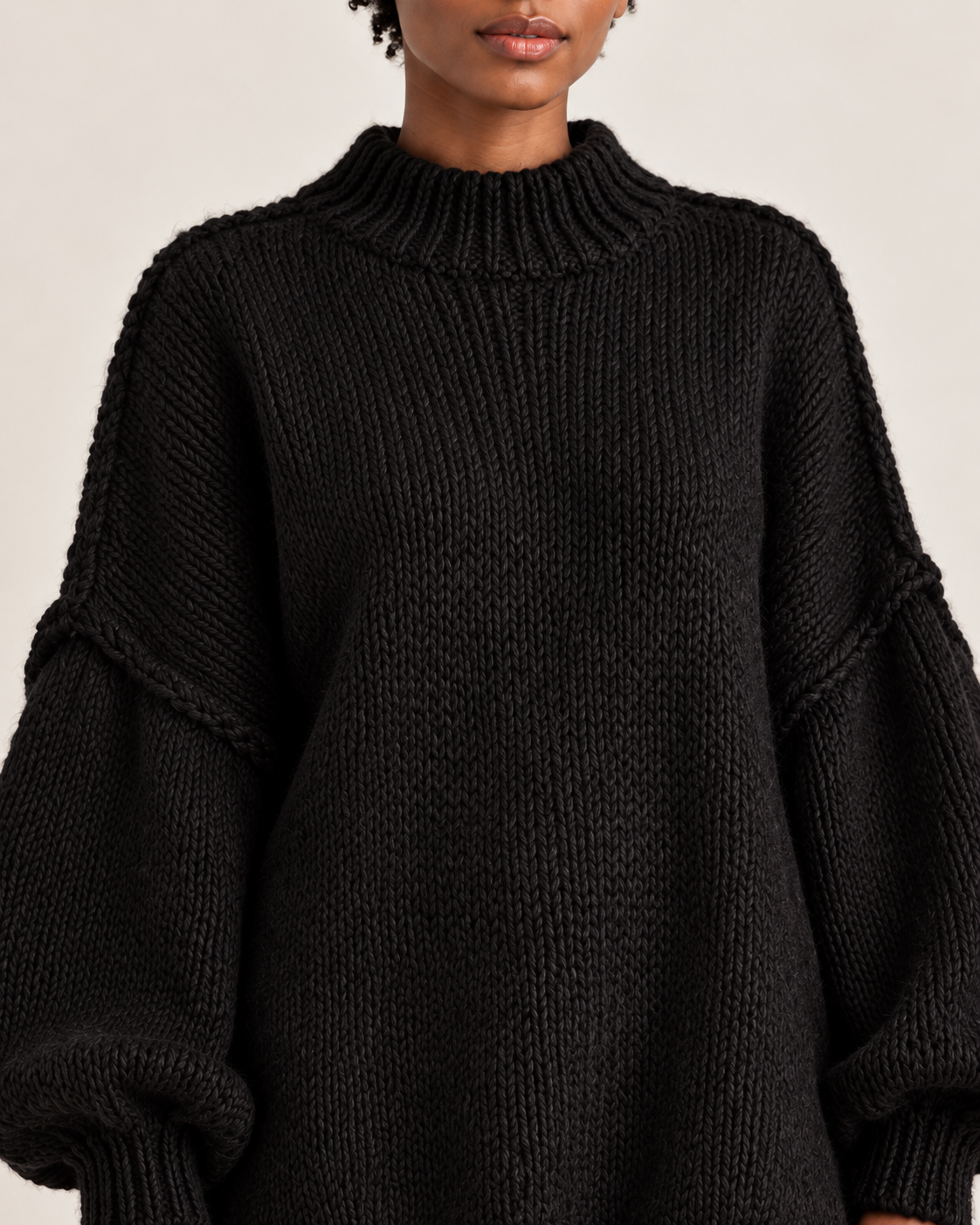 Women's jumper dress in black, neckline close-up