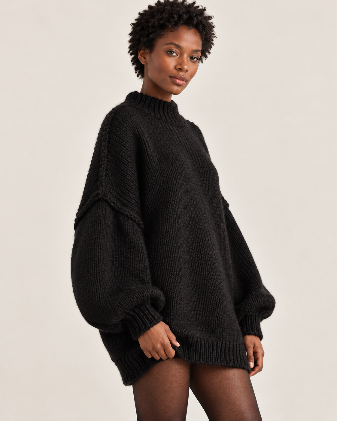 Women's jumper dress in black, three-quarter view