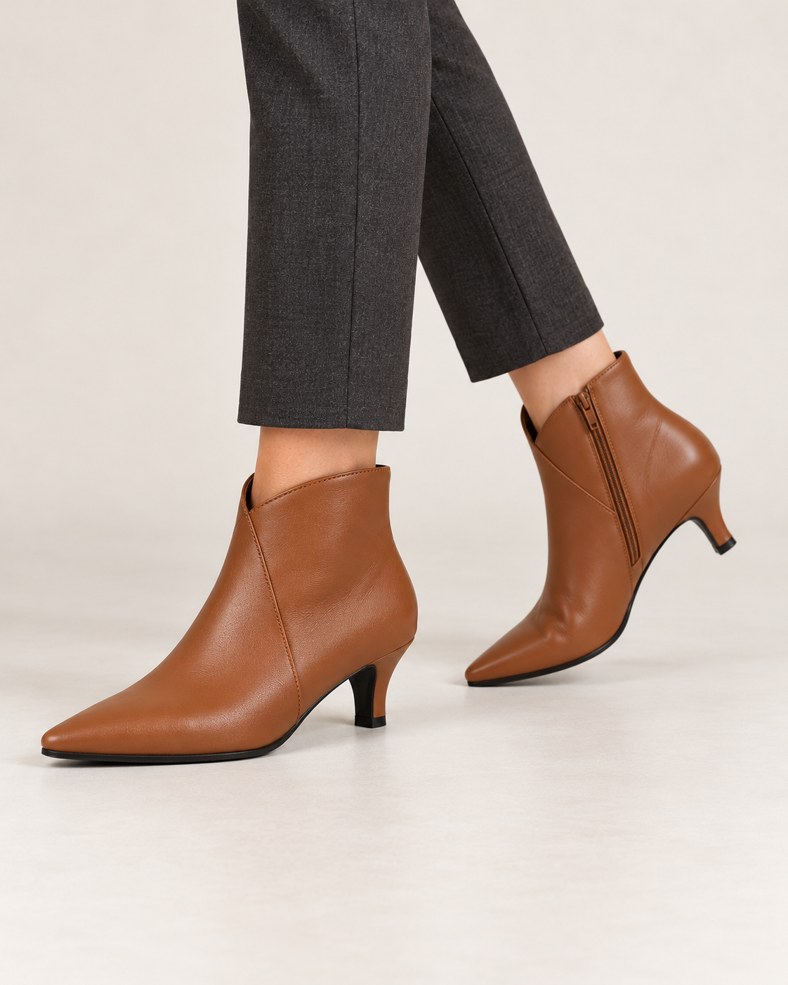Women's kitten heel ankle boots in brown, walking step