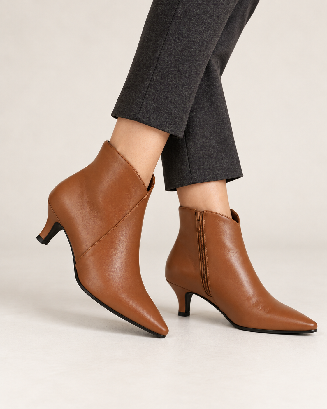 Women's kitten heel ankle boots in brown, seated view