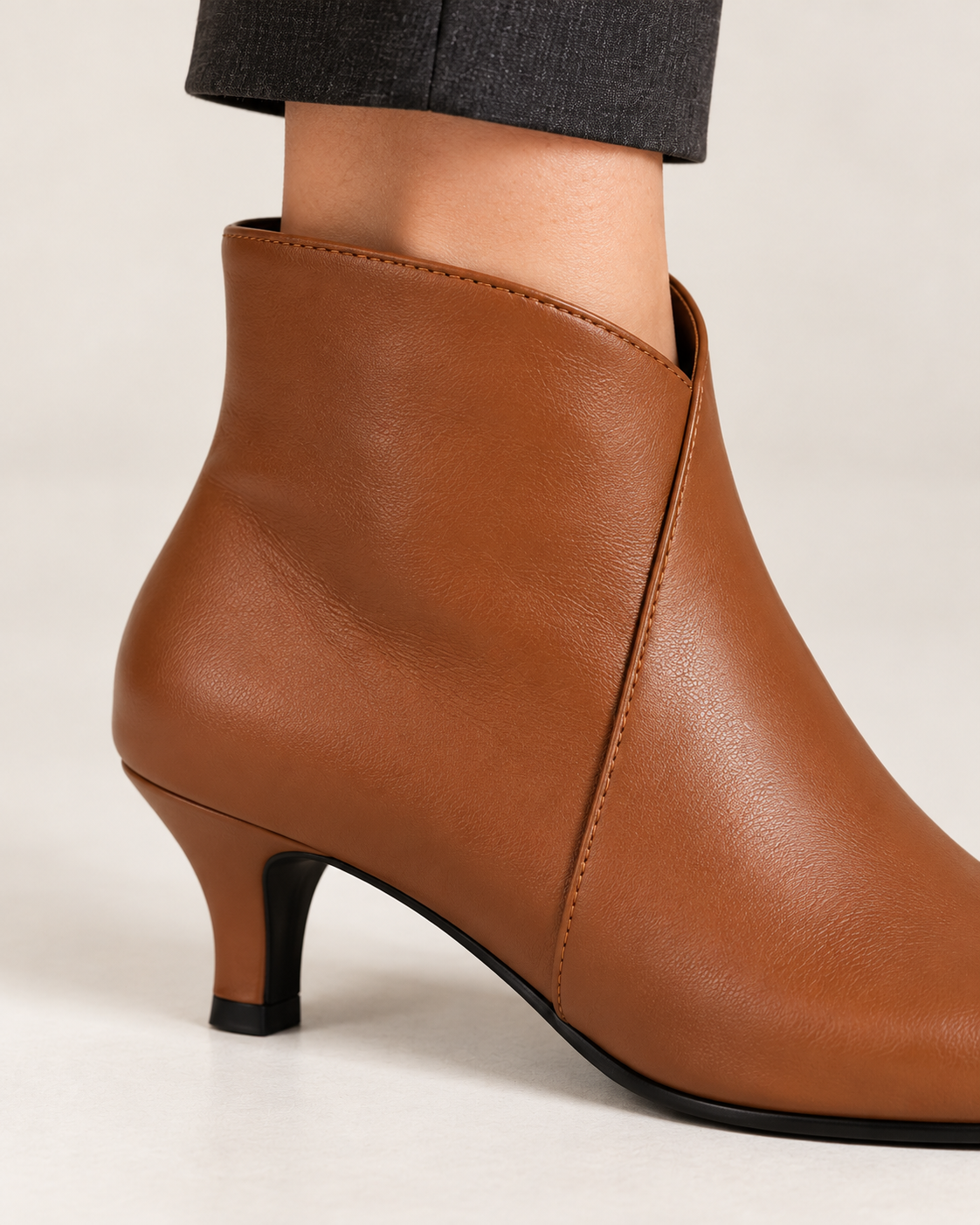 Women's kitten heel ankle boots in brown, material and heel detail