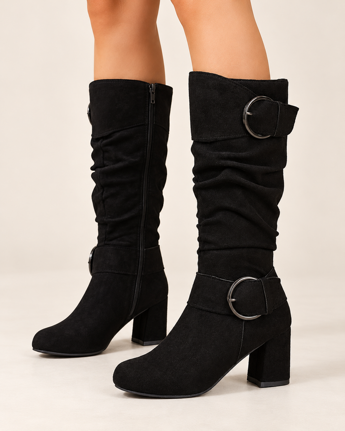 Women's knee high boots in black, side view