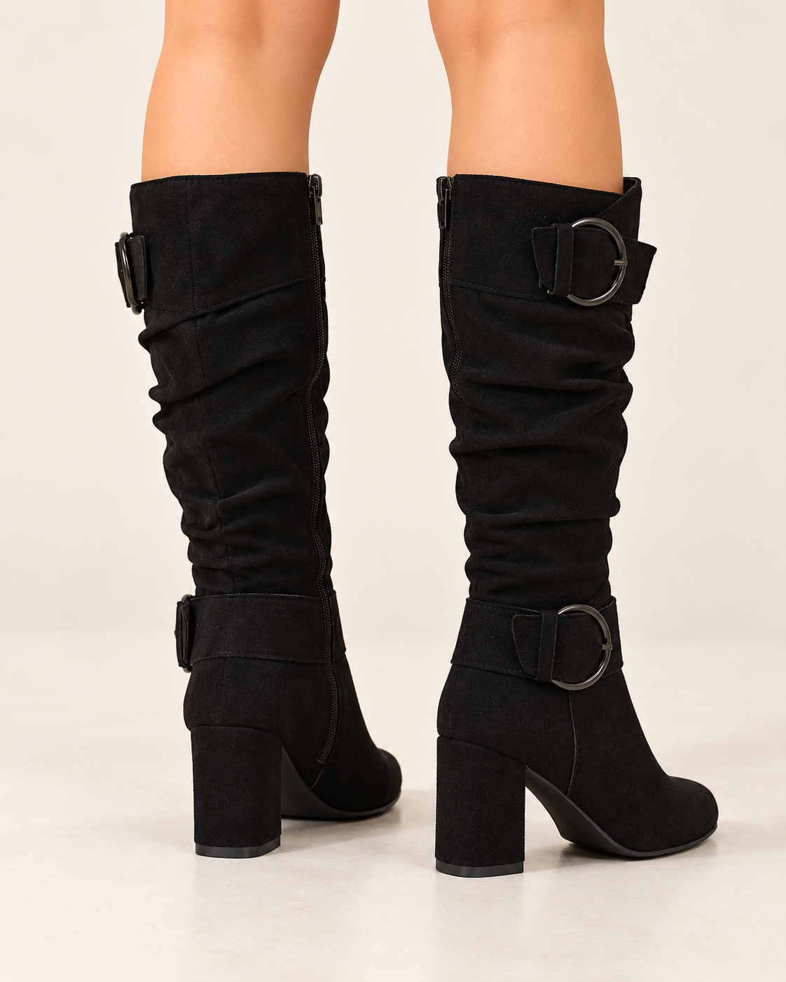 Women's knee high boots in black, back and heel view