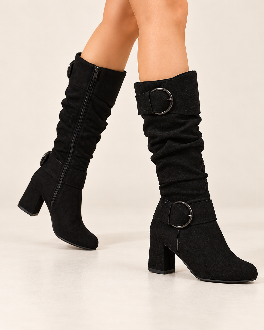 Women's knee high boots in black, walking view