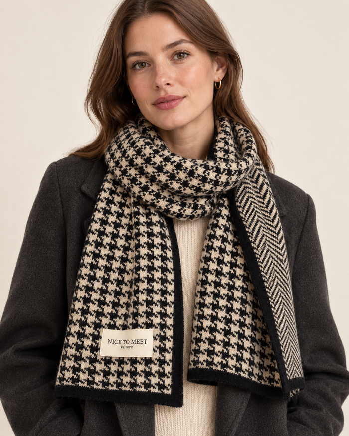 Women's black reversible houndstooth scarf - front view on model
