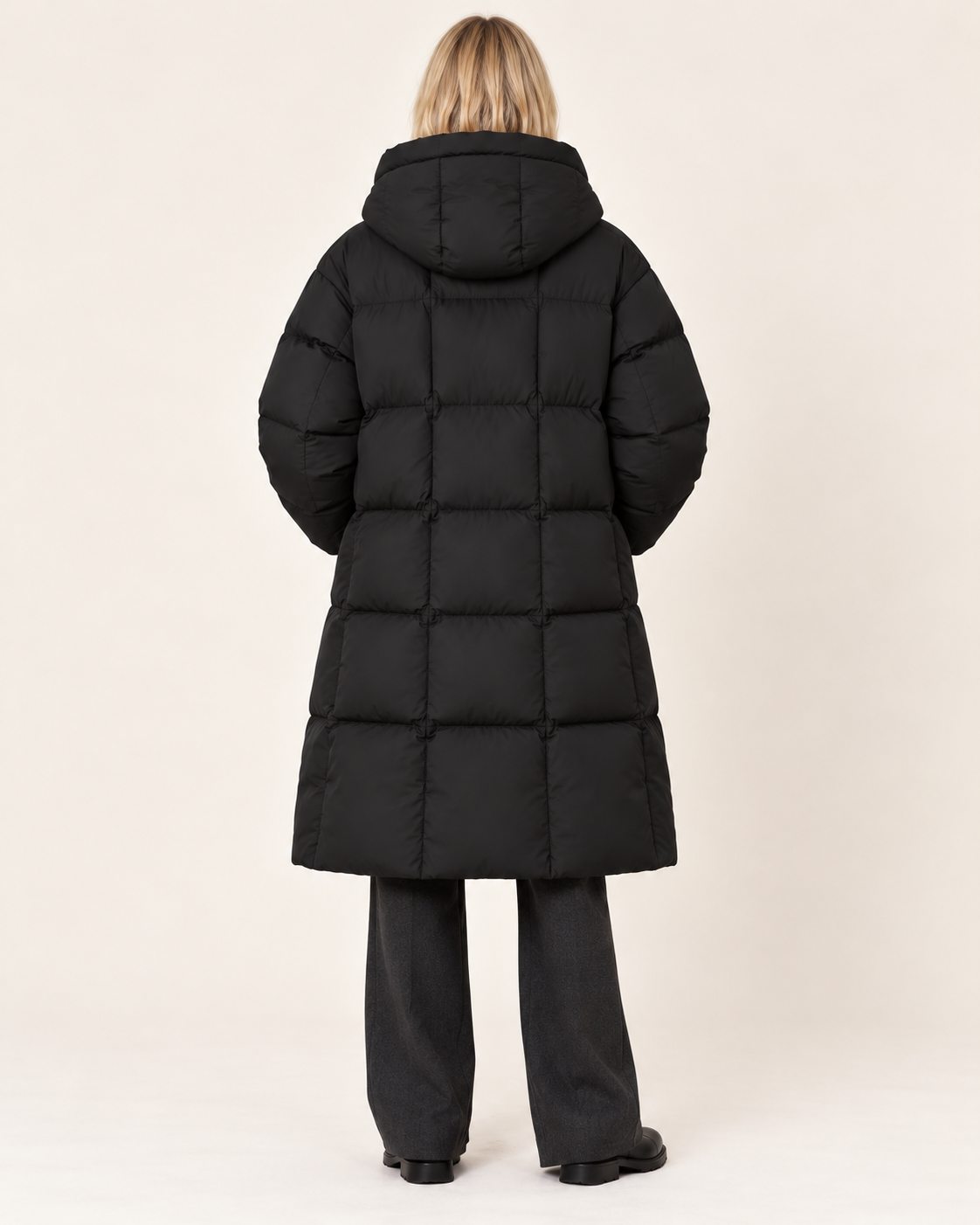Women's long puffer coat in black, back view