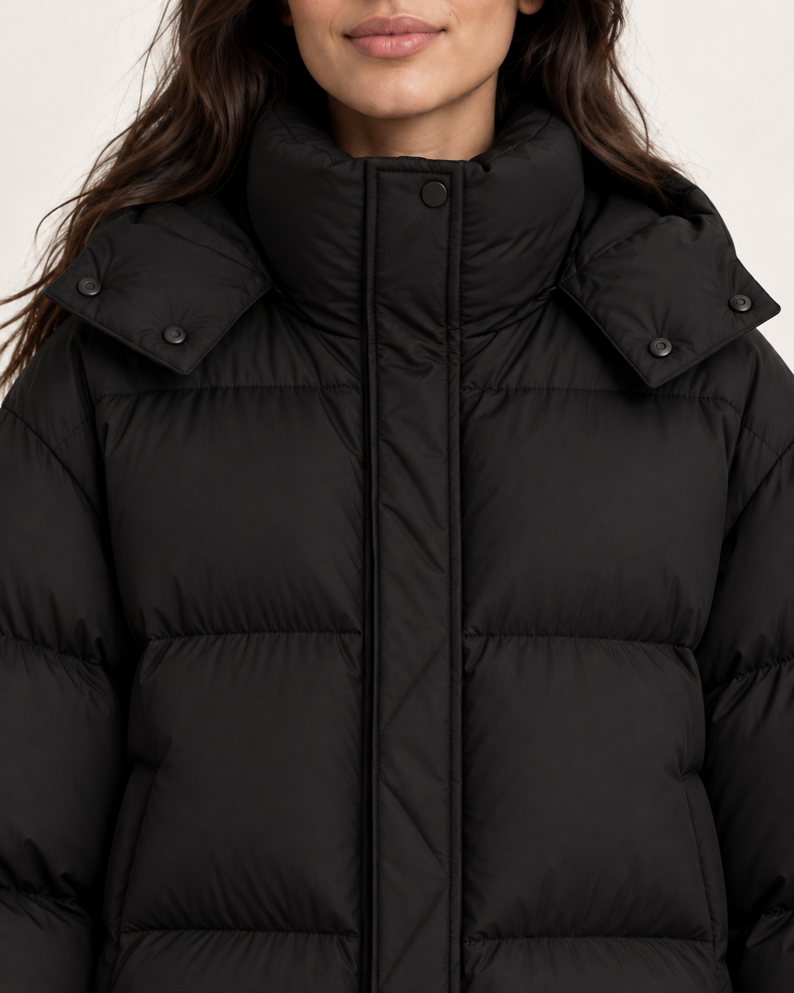 Women's puffer jacket in black, high collar close-up
