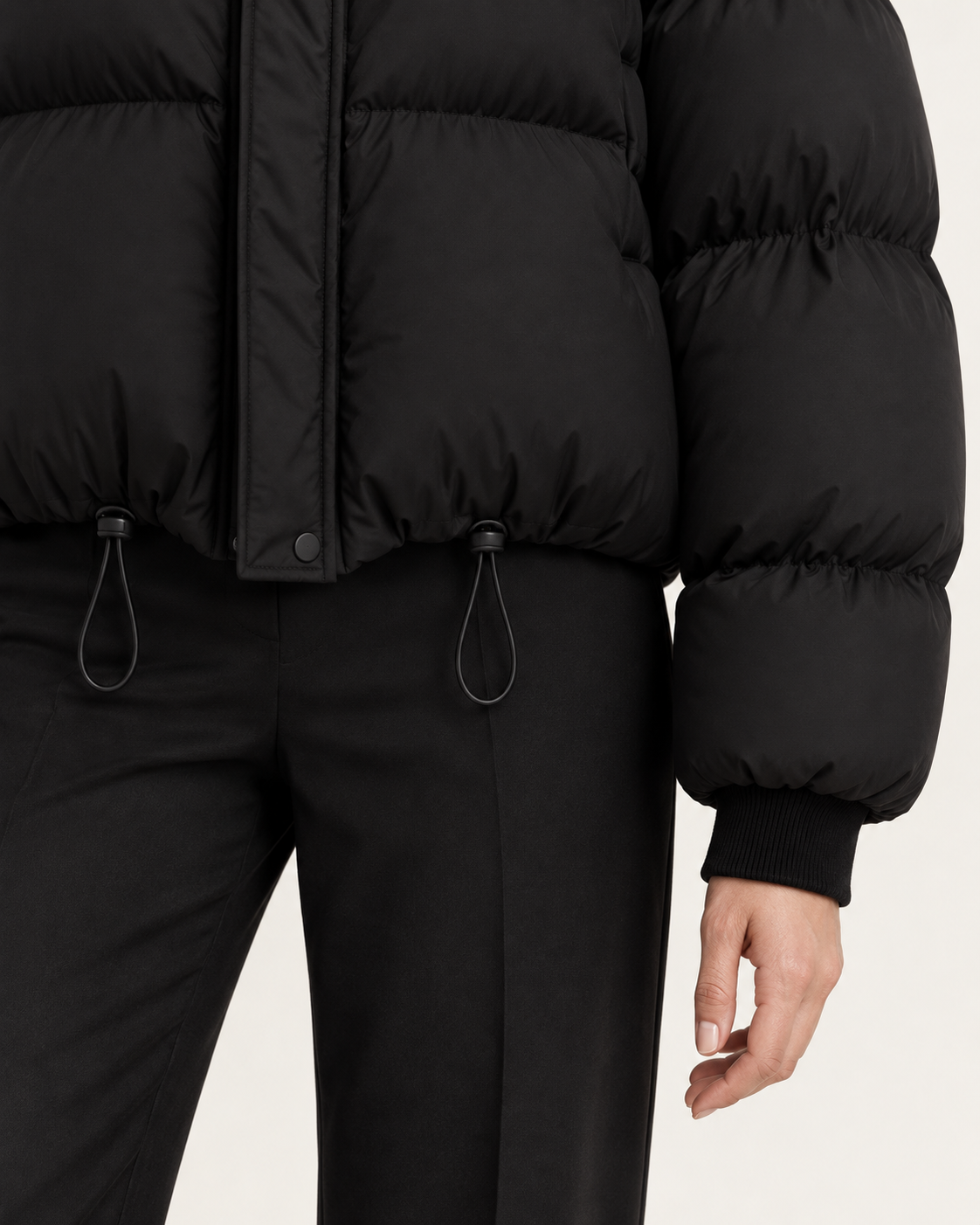 Women's puffer jacket in black, drawstring hem and ribbed cuff detail