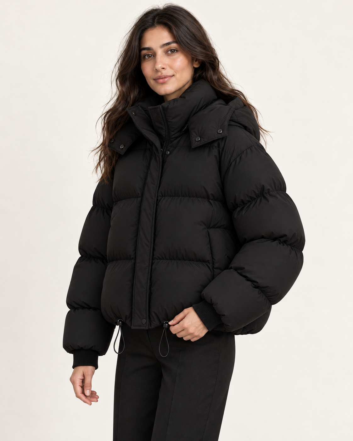 Women's puffer jacket in black, side view