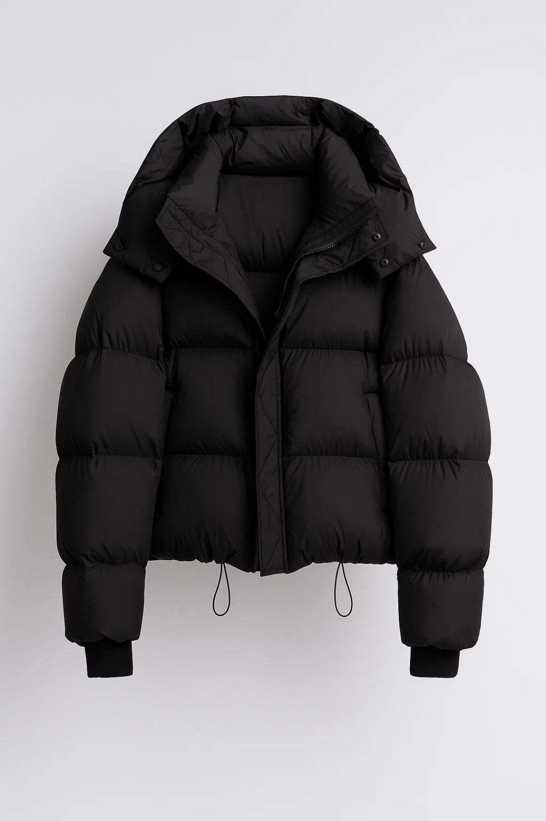 Women's puffer jacket in black, product view