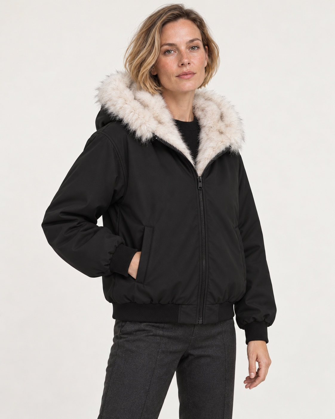 Women's faux fur lined bomber jacket in black, three-quarter view