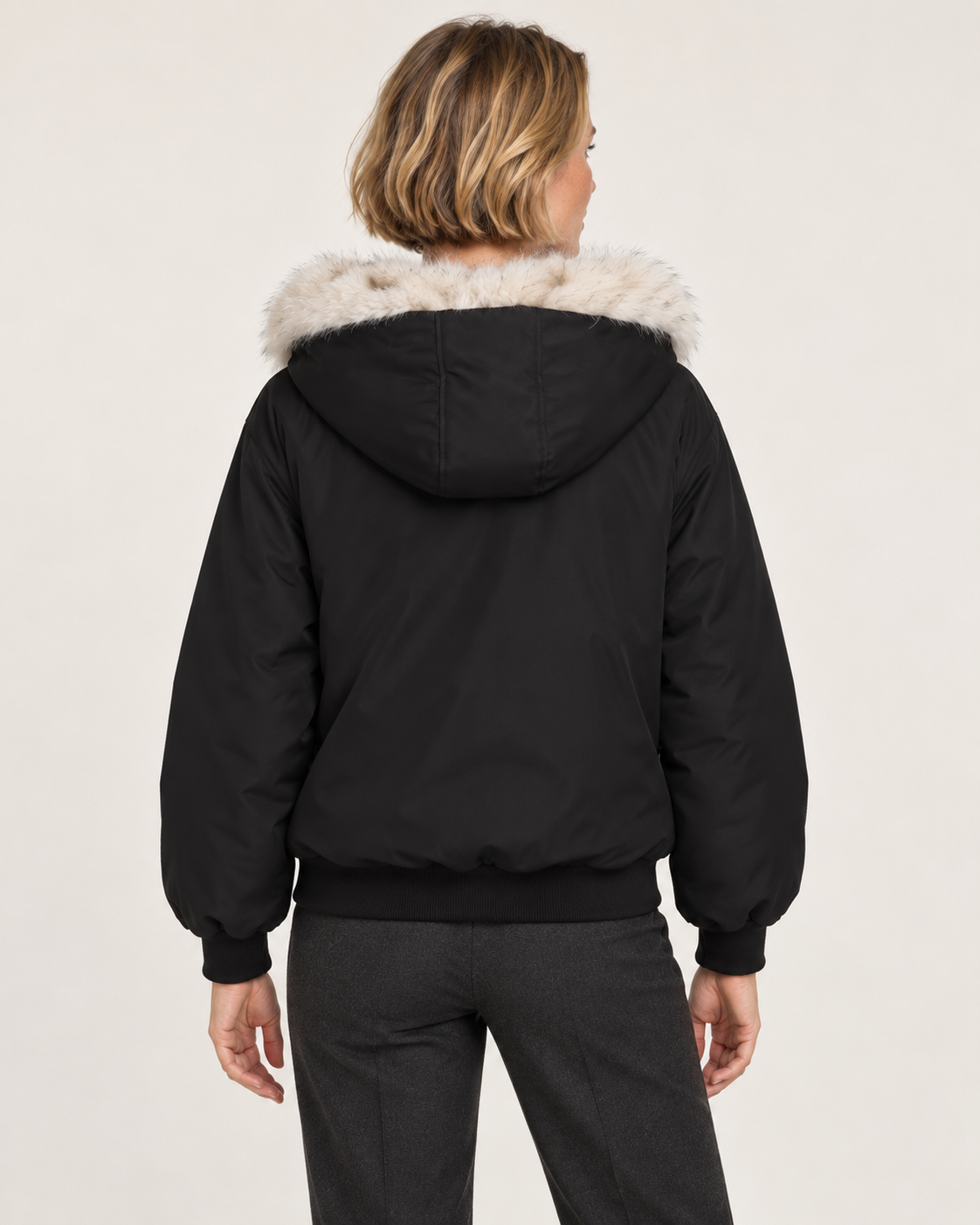 Women's faux fur lined bomber jacket in black, back view