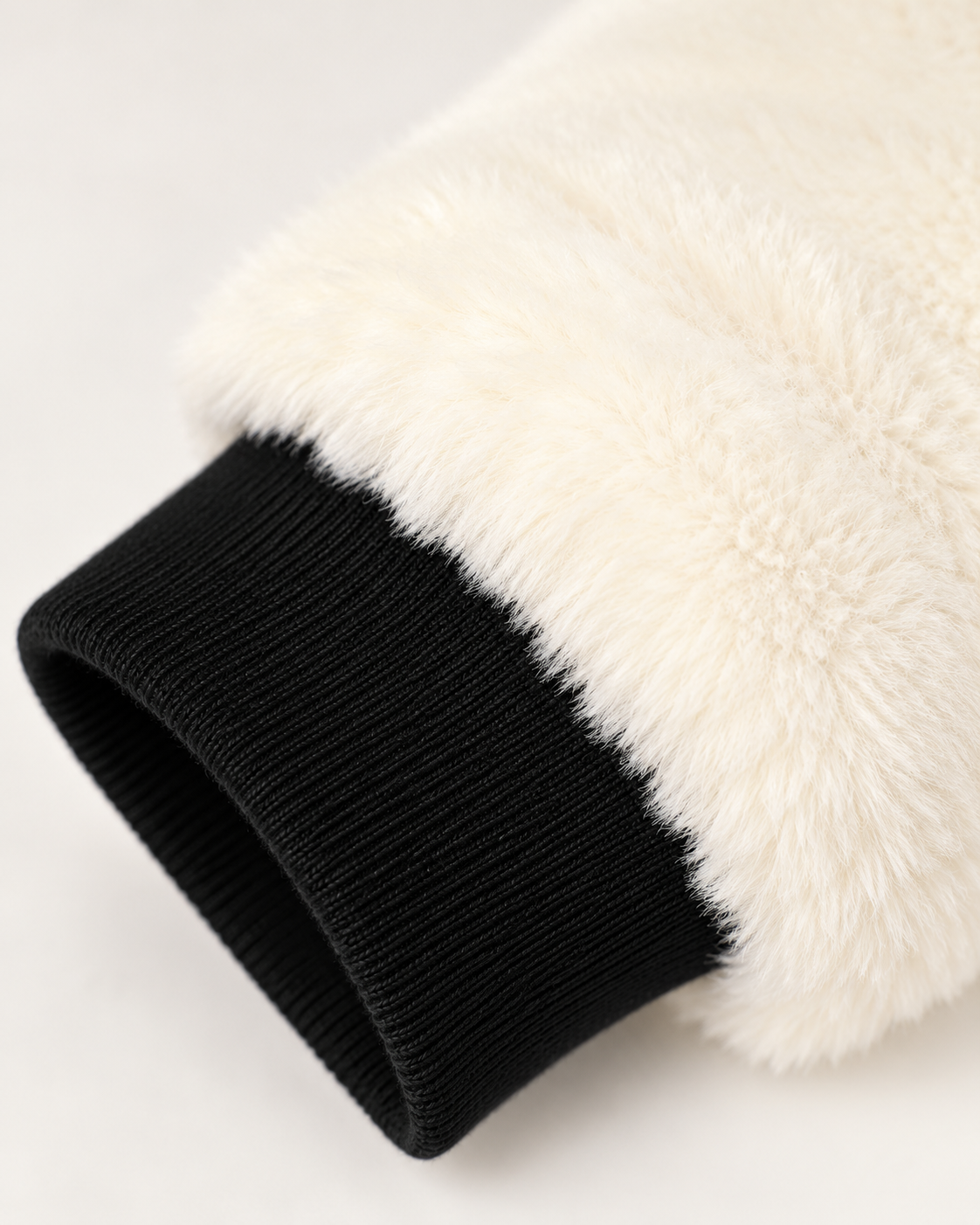 Women's faux fur lined bomber jacket in black, detail view