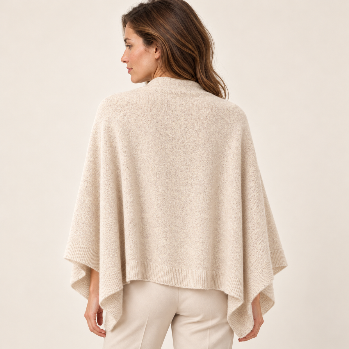 Beige scarf — Back view of the same woman wearing the same pale beige scarf draped over shoulders, showing broad uninterrupted back panel