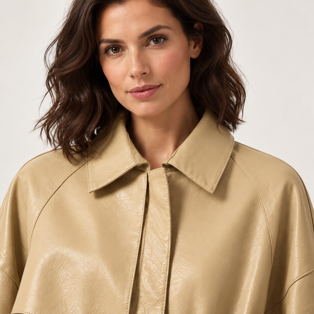 Beige leather jacket — chest-up on model